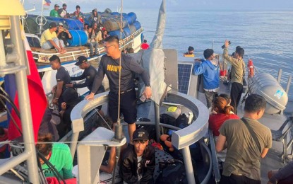 <p><strong>RESCUED AT SEA.</strong> Personnel of the Naval Forces Western Mindanao (NFWM) rescued 28 people from a wooden-hulled vessel in distress in the waters of Favorite Bank, Basilan province Monday evening (Feb. 6, 2023). The vessel was sailing to the town of Turtle Islands in Tawi-Tawi coming from Zamboanga City when its engine malfunctioned.<em> (Photo courtesy of NFWM)</em></p>