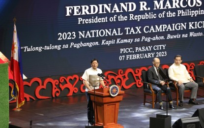 <p><strong>PUBLIC TRUST.</strong> President Ferdinand R. Marcos Jr. delivers a speech during the National Tax Campaign kickoff at the Philippine International Convention Center in Pasay City, also graced by Finance Secretary Benjaimin Diokno (seated, left) and House of Representatives Speaker Martin Romualdez, on Tuesday (Feb. 7, 2023). Marcos challenged the Bureau of Internal Revenue to further gain the confidence of the public by upholding the highest standards of integrity, professionalism and competence in the performance of their duties.<em> (PNA photo by Yancy Lim)</em></p>