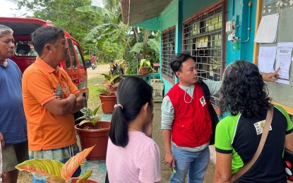 <p><strong>LISTING VERIFICATION.</strong> An employee of the Department of Social Welfare and Development (DSWD) explains to the residents of Loon, Bohol the Pantawid Pamilyang Pilipino Program's list of beneficiaries being posted in a barangay hall, in this undated photo. DSWD-7 Director Shalaine Marie Lucero said Wednesday (Feb. 8, 2023) they need the help of barangay officials in verifying the new list of potential 4Ps beneficiaries posted in their localities. <em>(Photo courtesy of DSWD-7)</em></p>