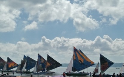 <p><strong>PARAW REGATTA</strong>. Colorful paraws line the shorelines of Villa beach in Iloilo City during the 2018 Paraw Regatta Festival. The annual sailing competition will have a comeback from March 12-19, 2023 after it was temporarily put on hold during the health pandemic. <em>(PNA file photo by PGLena)</em></p>