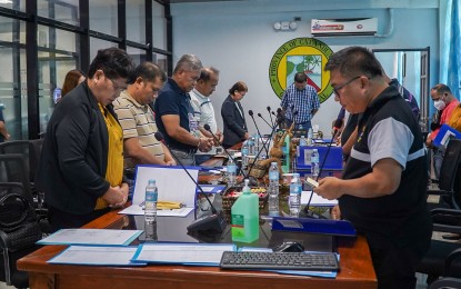 <p><strong>PRAYER BEFORE MEETING</strong>. Members of the Catanduanes Development Council are shown praying before starting their meeting to discuss the Provincial Commodity Investment Plan (PCIP) for Abaca with Climate Risk Vulnerability Assessment (CRVA) on Friday (Feb. 3, 2023). The rehabilitation and recovery of abaca plantations throughout the province were initiated because of the devastation caused by typhoons last year. <em>(Photo from LGU-Catanduanes's Facebook page)</em></p>