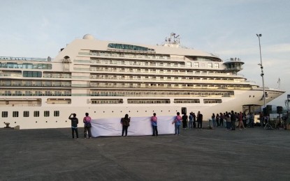 <p><strong>ANCHORS OU</strong>T. Seabourn Encore, the first cruise ship to visit the Philippines after the Covid-19 pandemic, arrived and docked at the Puerto Princesa City seaport in Palawan province on Thursday (Feb. 9, 2023). The city government expects more cruise ships to visit and contribute greatly to the tourism industry. <em>(PNA photo by Gerald Ticke)</em><br /><br /></p>