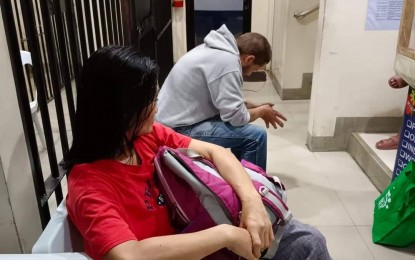<p><strong>MURDER SUSPECTS.</strong> Myla Ozoa Cagas and Tim Moerch, a Danish, at the Valencia police station. The photo was taken hours before they were killed Wednesday night. The two were tagged as suspects in the death of Paolo Teves, the younger brother of Mayor Edgar Teves Jr of Valencia, Negros Oriental. (<em>Photo courtesy of Bhoy Pilonggo)</em></p>