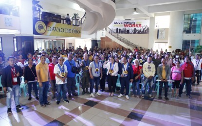 <p><strong>LIVELIHOOD BENEFICIARIES.</strong> Representatives of 66 people’s organizations in Davao de Oro province pose for a photo together with local and national officials after the distribution Wednesday (Feb.8, 2023) of PHP19.8 million financial aid. The assistance came from the Payapa at Masaganang Pamayanan - Sustainable Livelihood Program funded by the Office of the President. <em>(Photo courtesy of Davao de Oro PIO)</em></p>