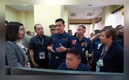 <p><strong>BORDER CONTROL.</strong> Cebu Governor Gwendolyn Garcia (left) listens as a coast guard officer briefs her on the vessel traffic management system and national coast watch system at the Philippine Coast Guard District-Central Visayas in Cebu City on Wednesday (Feb. 8, 2023). Garcia pledged to help equip law enforcement agencies that would bolster the province's anti-drug efforts. <em>(Screengrab from Cebu Provincial Capitol PIO video)</em></p>