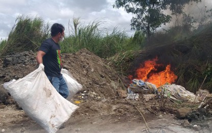 <p><strong>DISPOSAL</strong>. A veterinary quarantine personnel burns the undocumented table eggs transported from Bantayan Island, Cebu province after the shipment was intercepted at the Bredco port in Bacolod City on Feb. 5, 2022. The 240,000 pieces of eggs were shipped without a permit and other pertinent documents. <em>(Photo courtesy of BAI-Veterinary Quarantine Station 6)</em></p>