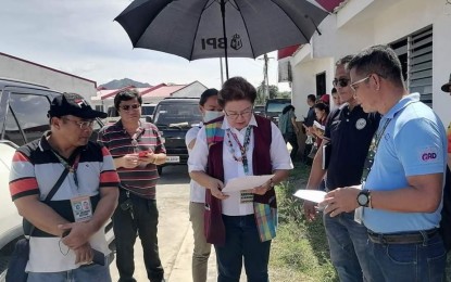 <p><strong>SITE VALIDATION</strong>. Antique Governor Rhodora J. Cadiao confers with Laua-an Mayor Aser Baladjay (2nd from right, partly hidden) and other key officials about their recommendations to solve the flooding problem at the National Housing Authority (NHA) relocation site in Barangay Lugta, Laua-an during their site validation on Feb. 3, 2023. Mayor Baladjay said in an interview Friday (Feb. 10, 2023) that he is now negotiating with the landowners to purchase a portion of their lands along the relocation site for the drainage system. <em>(Photo courtesy of Eby Butiong)</em></p>