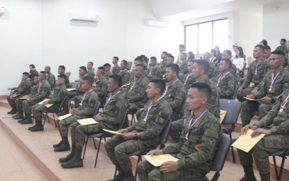 <p><strong>SOLDIER-GRADUATES.</strong> Forty-five soldiers of the Army's 10th Infantry Division (10ID) who have completed their elementary and junior high school education join a moving-up and graduation ceremony held in Camp General Manuel T. Yan Senior in Mawab, Davao de Oro on Feb. 8, 2023. The graduates consisted of Indigenous People members and former rebels recruited on special enlistment. <em>(Photo courtesy of 10ID)</em></p>
