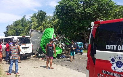 <p><strong>TRAGEDY.</strong> The accident site in Purok 11, Barangay Poblacion, Naawan, Misamis Oriental where seven active police officers and one retired cop died on Saturday morning (Feb. 11, 2023). The busted front wheel of a wing van coming from the opposite direction caused it to collide with the officers' two vans. <em>(Courtesy of Iligan City CDRRMO Facebook)</em></p>