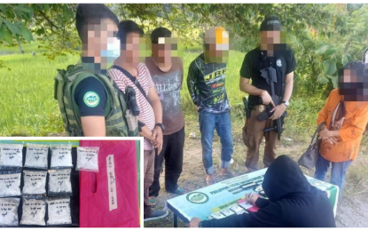 <p><strong>BUSTED DUO</strong>. Backed by the police, anti-narcotics agents of the Bangsamoro Autonomous Region in Muslim Mindanao arrest two alleged high-value targets (3rd and 4th left) during a buy-bust in Sultan Kudarat town, Maguindanao del Norte, on Sunday (Feb. 12, 2023). An estimated PHP3.4 million worth of shabu was seized from the suspects. <em>(Photo courtesy of PDEA BARMM)</em></p>