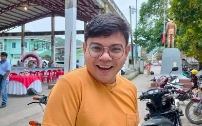 <p><strong>DRESSED FOR SEDUCTION</strong>. Jovertson Atienza, public information office staff of the Mulanay local government unit in Quezon province, flaunts his yellow shirt, representing his "marupok" (easily seduced) status. LGU employees wore color-coded work attire that corresponded to the status of their love life, encouraged by Mayor Aris Aguirre on Valentine's Day (Feb. 14, 2023). <em>(Photo courtesy of Mulanay Public Information Office)</em></p>