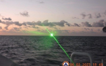 <p><strong>UNPROVOKED.</strong> The Philippine Coast Guard records the military-grade laser light directed by a China Coast Guard vessel at the BRP Malapascua while at Ayungin Shoal in the West Philippine Sea on Feb. 6, 2023. The Philippine vessel was supporting a rotation and resupply mission of the Philippine Navy in Ayungin Shoal at the time. <em>(Courtesy of PCG Facebook)</em></p>