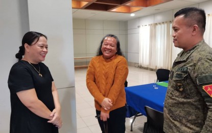 <p><strong>COLLABORATION</strong>. Department of the Interior and Local Government-Negros Oriental provincial director Farah Gentuya (left) exchanges pleasantries with provincial engineer Maelene Jimenez and Lt. Col. Van Donald Almonte, commanding officer of the 94th IB, during a recent meeting on the Enhanced Comprehensive Local Integration Program. The Army commander said they are continuing operations in at least four towns in Negros Oriental province that are still affected by communist insurgency. <em>(Photo by Judy Flores Partlow)</em></p>