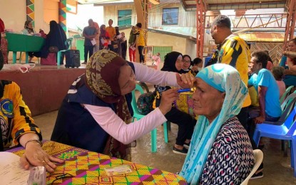 <p><strong>IMPROVING VISION.</strong> An eye specialist from the Ministry of Health of the Bangsamoro Autonomous Region in Muslim Mindanao (BARMM) examines a resident of Sitangkai town, Tawi-Tawi during an outreach program on Feb. 12, 2023. At least 690 indigent patients benefited from the free medical services. <em>(Photo courtesy of BTA-BARMM member Amir Mawallil)</em></p>