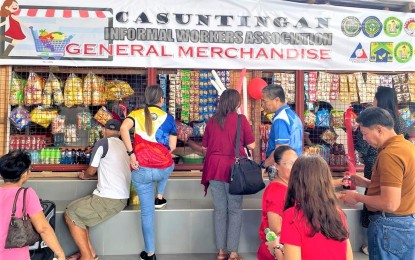 <p><strong>INFORMAL WORKERS.</strong> Photo shows the general merchandise business of the 57-member Casuntingan Informal Workers Association in Barangay Casuntingan, Mandaue City being patronized by the neighborhood. DOLE-7 Tri-City field office head Marites Mercado said the association received almost PHP1 million worth of jigs and materials to materialize their business plan, a store of basic commodities for the community. <em>(Photo courtesy of DOLE-7)</em></p>