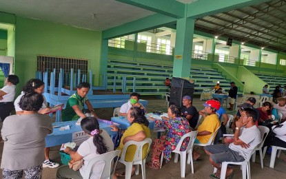 <p><strong>AID FOR DINAGAT FARMERS.</strong> Some 107 rice farmers from the town of Cagdianao in Dinagat Islands province receive fertilizer discount vouchers in a distribution activity conducted by the Department of Agriculture in the Caraga Region on Tuesday (Feb. 14, 2023). A total of PHP3.2 million worth of discount vouchers were allocated for 805 rice farmers in the entire province. <em>(Photo courtesy of DA-13 Information Office)</em></p>