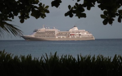 <p><strong>FOREIGN GUESTS</strong>. A cruise ship off the coast of Kalanggaman Island in this Feb. 10, 2023 photo. The return of cruise ships to Eastern Visayas after nearly three years of pandemic restrictions is a big boost to the local tourism industry, the Department of Tourism said Thursday. <em>(DOT Eastern Visayas photo)</em></p>