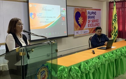 <p><strong>FILIPINO VALUES.</strong> Department of Tourism in the Caraga Region (DOT-13) Director Ivonnie Dumadag (left), together with Richard Amores (right), an accredited DOT-13 trainer, leads the opening of the Filipino Brand of Service Excellence (FBSE) training for 50 students on Wednesday (Feb. 15, 2023) in Surigao City. The DOT-13 is targeting some 7,000 tourism front-liners in the region to undergo the training this year. <em>(PNA photo by Alexander Lopez)</em></p>