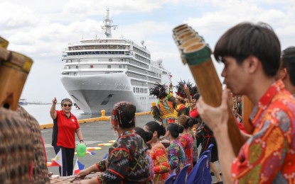 <p><strong>CRUISE TOURISM.</strong> Passengers onboard the Silver Spirit cruise ship are welcomed by tourism and city government officials at the Manila South Harbor on Feb. 15, 2023. As of May 28 this year, the DOT has logged 117 cruise calls with an estimated 123,042 passengers<em>. (PNA photo by Yancy Lim)</em></p>