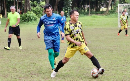 <p><strong>LOVE OF FOOTBALL.</strong> Yanti Barsales (right) in action for the Philippine Airfare Legends team in the 40-and above category during the 4ID Diamond Cup Football Festival at Camp Evangelista in Cagayan de Oro City on Feb. 12, 2023. At his current age, Barsales still professes his love for football. <em>(PNA photo by Jack Biantan)</em></p>
