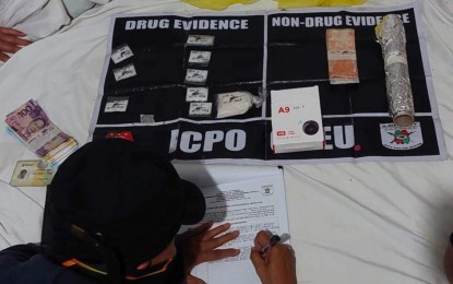 <p><strong>ILLEGAL DRUGS</strong>. Policemen confiscate 150 grams of shabu valued at PHP1.02 million from 43-year-old suspect Praud Joan Animas during a buy-bust operation in Barangay Lanit in Jaro district, Iloilo City on Feb. 18, 2023. The Iloilo City Police Office (ICPO) has netted over 210 grams of shabu valued at more than PHP1.428 million in a series of anti-drug operations from Jan. 27 to Feb. 19 based on its accomplishment report. <em>(Photo courtesy of ICPO)</em></p>