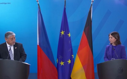 <p>Foreign Affairs Secretary Enrique Manalo with German Foreign Minister Annalena Baerbock during a joint conference at the sidelines of the Munich Security Conference on Feb. 20, 2023. <em>(Screengrab from German Foreign Office video)</em></p>