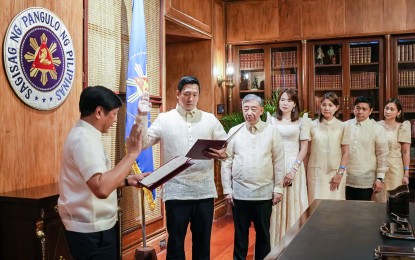 <p><strong>SPECIAL ENVOY</strong>. President Ferdinand R. Marcos Jr. leads the oath-taking rites for businessman Benito Techico at Malacañan Palace in Manila on Tuesday (Feb. 21, 2023). Marcos appointed Techico as special envoy to China for trade, investments and tourism. <em>(Photo courtesy of the Presidential Communications Office)</em></p>
