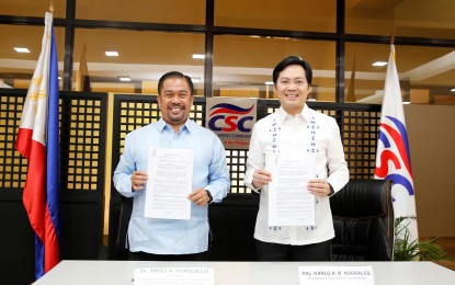 <p>Civil Service Commission (CSC) Chairperson Karlo Nograles (left) renews the memorandum of agreement with Philippine Association of State Universities and Colleges President Dr. Tirso Ronquillo (right) on the <em>Pamanang Lingkod-Bayan Iskolarsyip on</em> Thursday (Feb. 23, 2023) at the CSC Central Office, Quezon City. <em>(Photo courtesy of CSC)</em></p>