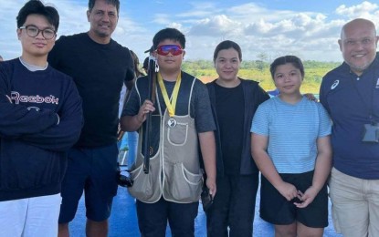 <p><strong>JUNIOR CHAMPION</strong>. Antonio Joseph Javines (3rd from left) bags the juniors trap and skeet title of the National Open at the PSC-PNSA Clay Target Range in Muntinlupa City on Feb. 17, 2023. Also in the photo are brother Philip Javines, actor-sportsman Richard Gomez, mother Michele Javines, sister Monica Tish and coach Fernando Mercado.<em> (Contributed photo)</em></p>