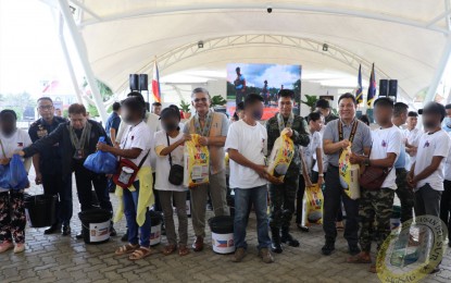 <p><strong>SUPPORT TO FORMER REBELS.</strong> At least 52 former communist rebels and 200 mass-based supporters availed of benefits from the government’s Enhanced Comprehensive Local Integration Program in Agusan del Sur province on Thursday (Feb. 23, 2023). The event, facilitated by the Police Regional Office in the Caraga Region, is graced by Presidential Anti-Organized Crime Secretary Gilberto DC Cruz together with several Philippine National Police officials<em>. (Photo courtesy of Agusan del Sur PPO)</em></p>