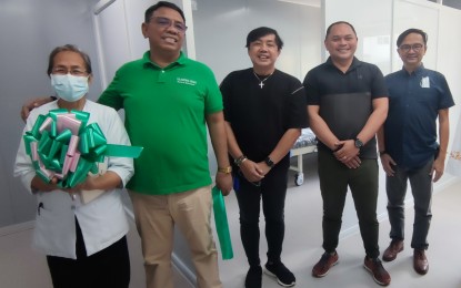 <p><strong>NEW ICU ROOM</strong>. Quezon Medical Center's Chief of Hospitals Dr. Jef Villanueva (center) and Quezon Second District Rep. David ‘Jay-Jay’ Suarez (2nd from right) outside one of the 24 new modular hospital rooms at QMC in Lucena City. The 24-bed capacity modular ICU facility is opened to the public starting on Friday (Feb. 24, 2023). <em>(PNA photo by Belinda Otordoz)</em></p>