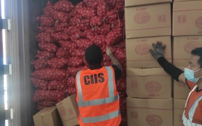 <p style="text-align: left;"><strong>SMUGGLED GOODS. </strong>Personnel of the Customs Intelligence and Investigation Service (CIIS) inspect the shipments that contain smuggled onions, sugar, and cigarettes at the Manila International Container Port (MICP) in this undated photo. The Bureau of Customs (BOC) on Thursday (May 18, 2023) assured they would address "loopholes" to effectively eradicate agri smuggling. <em>(Photo from BOC) </em></p>