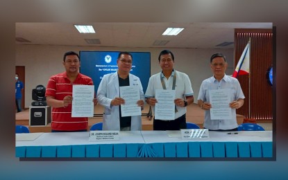 <p><strong>PARTNERSHIP</strong>. Region 1 Medical Center chief Dr. Roland Joseph Mejia (2nd from left) and Pangasinan 1st District Rep. Arthur Celeste (2nd from right), together with other officials, show the newly signed Memorandum of Agreement for an Eye Care Program on Friday (Feb. 24, 2023). The "Oplan Balik Tanaw" program will kick off in Bani town next month. <em>(Photo by Liwayway Yparraguirre)</em></p>