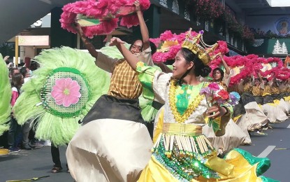 <p><strong>FLOWERS IN BLOOM.</strong> The Panagbenga street dancing contingent from La Union performs along Session Road in Baguio City on Saturday (Feb. 26, 2023). Mauricio Domogan, lifetime chairperson of the Baguio Flower Festival Foundation, said this year's festival is as important as the first one held in 1996 because they have the same goal -- to uplift the lives of the people after a crisis.<em> (PNA photo by Liza T. Agoot)</em></p>