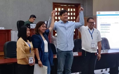 <p><strong>NEW LAWMAKER.</strong> Crispin Diego Remulla (3rd from left) is proclaimed the new representative of Cavite province’s 7th district on Sunday (Feb. 26, 2023) following the special election the day before. He is flanked by Cavite provincial election officer Mitzele Veron Morales (second from left) and Provincial Board of Canvassers member Dr. Rommel Bautista.<em> (PNA photo by Rossel Calderon)</em></p>