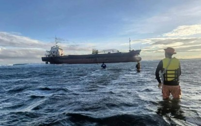 <p><strong>RESCUE.</strong> The Philippine Coast Guard in Occidental Mindoro rescued on Monday (Feb. 27, 2023) 14 crew members of a cargo vessel that suffered engine trouble and ran aground on Lubang Island in Occidental Mindoro. The PCG-Occidental Mindoro is continuously monitoring the grounded vessel (in photo) to check for any signs of oil spillage.<em> (Photo courtesy of PCG-Occidental Mindoro)</em></p>