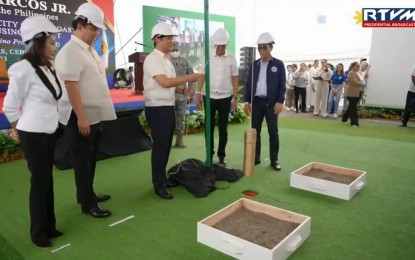<p><strong>CEBU CITY HOUSING.</strong> President Ferdinand "Bongbong" Marcos Jr. leads the groundbreaking and time capsule laying for the Cebu City South Coastal Urban Development Housing Project at the South Road Properties in Barangay Basak San Nicolas, Cebu City on Monday (Feb. 27, 2023), as (from left) Cebu Governor Gwendolyn Garcia, House Speaker Martin Romualdez, Cebu City Mayor Michael Rama, and Department of Human Settlement and Urban Development Secretary Jose Acuzar joined him. Marcos vowed affordable housing for low-wage earners and informal settlers. (<em>Screengrab from RTVM video)</em></p>