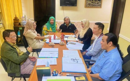 <p><strong>MORE INVESTMENTS.</strong> Members of the Bangsamoro Board of Investments (BBOI), led Chairperson Mohamad Omar Pasigan (right), approve two investments amounting to PHP129.8 million. The BBOI is eyeing PHP2.5 billion worth of investments for 2023. <em>(Photo courtesy of BBOI)</em></p>