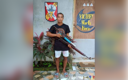 <p><strong>REBEL NO MORE.</strong> New People's Army rebel fighter 'Karding' poses with the two rifles that he turned over to the Army's Special Forces Battalion in Palimbang town, Sultan Kudarat province, after his surrender over the weekend. The surrenderer claimed that he was deceived into joining the communist rebel group. <em>(Photo courtesy of 6ID)</em></p>