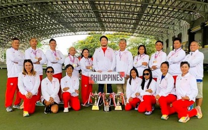 <p><strong>VICTORIOUS.</strong> Filipino medal winners join their teammates during the awarding ceremony of the 14th Asian Lawn Bowls Championships in Perak, Malaysia on Feb. 26, 2023. Standing (L-R) coach Reynaldo Samia, team members Homer Mercado, Leoncio Carreon Jr., Ronald Lising and Marisa Baronda; Philippine Lawn Bowls Association (PLBA) President Benito Pascual II and board of director Gene Lopez; Rosita Bradborn, Elmer Abatayo, Rodel Labayo and coach Chris Dagpin<em>. (Contributed photo)</em></p>