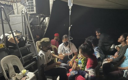 <p><strong>TOWED.</strong> Personnel of the Naval Forces Western Mindanao (NFWM) rendered medical assistance to the passengers of the ML Rihana that drifted to Malaysia after its engine malfunctioned while sailing to Turtle Islands municipality, from Bongao town, Tawi-Tawi province, on Feb. 24, 2023. The BRP-Florencio Iñigo of the Joint Task Force Tawi-Tawi towed the vessel from the anchorage area of Tanjung Labian, Malaysia, to the Lamion wharf in Bongao on Sunday morning (Feb. 26). <em>(Photo courtesy of the NFWM)</em></p>