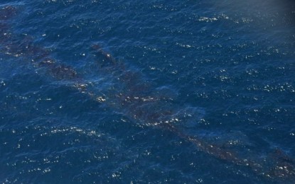 <p><strong>DISRUPTED LIVES</strong>. Thick and dark streaks of oil were observed by the Philippine Coast Guard Aviation Force during an aerial inspection off the coast of Oriental Mindoro in this March 1, 2023 photo. On Monday (May 29, 2023), the Police Regional Office-Mimaropa donated over PHP2 million to families whose livelihoods were disrupted by the oil spill.<em> (Photo courtesy of PCG)</em></p>