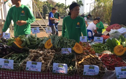 <p><strong>KADIWA STORE.</strong> Sellers begin offering more affordable agriculture products during the opening of the Kadiwa ng Pangulo bazaar at the Rizal Park in Manila on Wednesday (March 1, 2023). The program was launched by no less than President Ferdinand R. Marcos Jr.<em> (Photo from Ruth Abbey Gita-Carlos)</em></p>