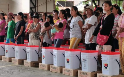 <p><strong>DISPLACED</strong>. The City of Himamaylan in Negros Occidental province, together with the Department of Social Welfare and Development, assists some 81 displaced families from four sitios (sub-village) in Barangay Carabalan, following a clash between New People's Army rebels and Philippine Army troops on Wednesday (March 1, 2023). The affected residents have been evacuated to the village covered court. <em>(Photo courtesy of Himamaylan City Social Welfare and Development Office)</em></p>