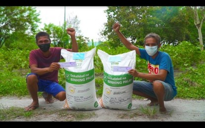 <p><strong>HOPE FOR FARMERS</strong>. Nestor Gido (left) and Cristito Acheta (right) from San Marcelino town, Zambales province are among the farmers who have benefited from the Rice Competitiveness Enhancement Fund (RCEF) Seed Program. They said their yields significantly increased as a result of using the certified seeds they received from the program.<em> (Photo courtesy of DA-PhilRice)</em></p>