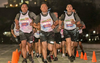 <p><strong>COLOR RUN.</strong> Army chief Lt. Gen. Romeo S. Brawner Jr. (center) leads the Office of the Commanding General (OCG) contingent during the 126th Philippine Army founding anniversary Color Run at Fort Bonifacio, Taguig City on Wednesday (March 1, 2023). The Color Run was one of the activities lined up to commemorate the Philippine Army’s founding anniversary which carried the theme “Army@126: Strong, United and Reliable." <em>(Photo courtesy of Philippine Army)</em></p>