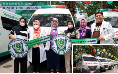 <p><strong>MORE AMBULANCES.</strong> Dr. Elizabeth Samama (3rd from left), Maguindanao provincial health officer, receives the symbolic key for one of the ambulances from health officials of the Bangsamoro Autonomous Region in Muslim Mindanao on Monday (March 6, 2023). At least 11 ambulances and a mobile clinic were distributed to health facilities in the region during the turnover in Cotabato City. <em>(Photo courtesy of MOH-BARMM)</em></p>
