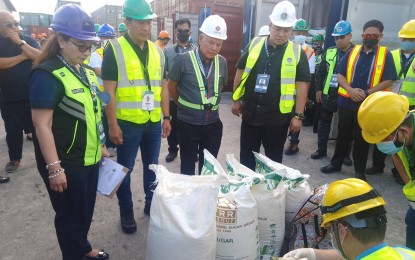 <p><strong>SMUGGLED SUGAR.</strong> The Department of Agriculture (DA) seizes a shipment of smuggled sugar at the Port of Subic on March 2, 2023. President Ferdinand R. Marcos Jr. has directed the Department of Finance (DOF) and the DA to study the proposal to conduct pre-shipping inspections of agricultural goods in a bid to curb the smuggling of agricultural products to the Philippines. <em>(Photo courtesy of Department of Agriculture)</em></p>