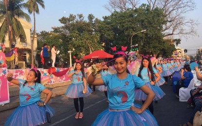 <p><strong>WOMEN'S MONTH</strong>. Residents of Ilocos Norte join the “kinni-kinni” parade in this file photo. The parade is among the activities that the local government prepares every year in celebration of National Women's Month. <em>(Photo by Leilanie Adriano)</em></p>