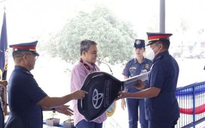 <p><strong>NEW VEHICLES.</strong> Police Regional Office in the Caraga Region (PRO-13) director Brig. Gen. Pablo Labra II (left), together with Surigao del Norte 2nd District Rep. Robert Ace Barbers (center), leads the turnover of brand-new vehicles to nine municipal police stations in a ceremony held in Butuan City on Tuesday (March 7, 2023. The patrol vehicles aim to bolster the police's anti-criminality campaign in the region. <em>(Photo courtesy of PRO-13)</em></p>